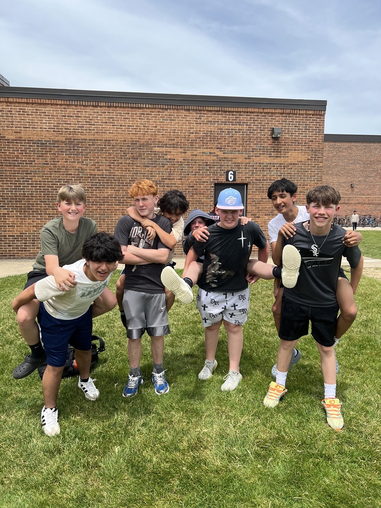 students posing with friends