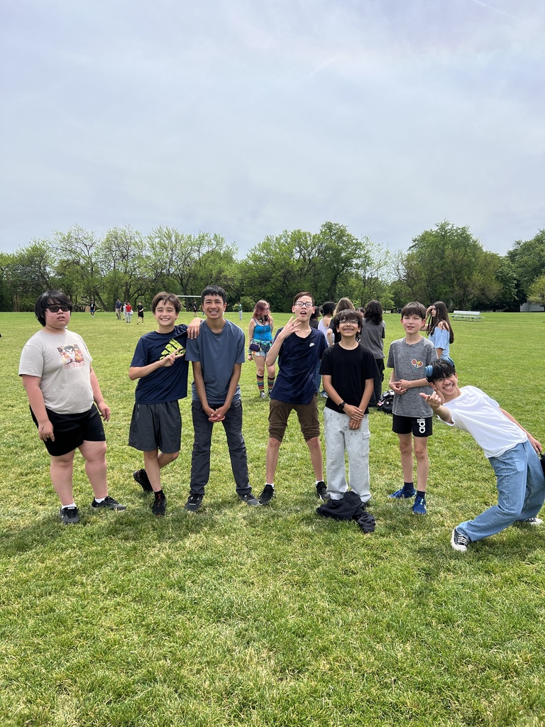 students posing with friends