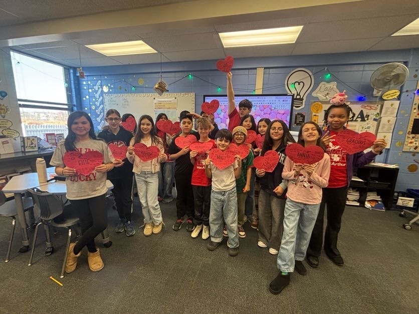 Students with love signs