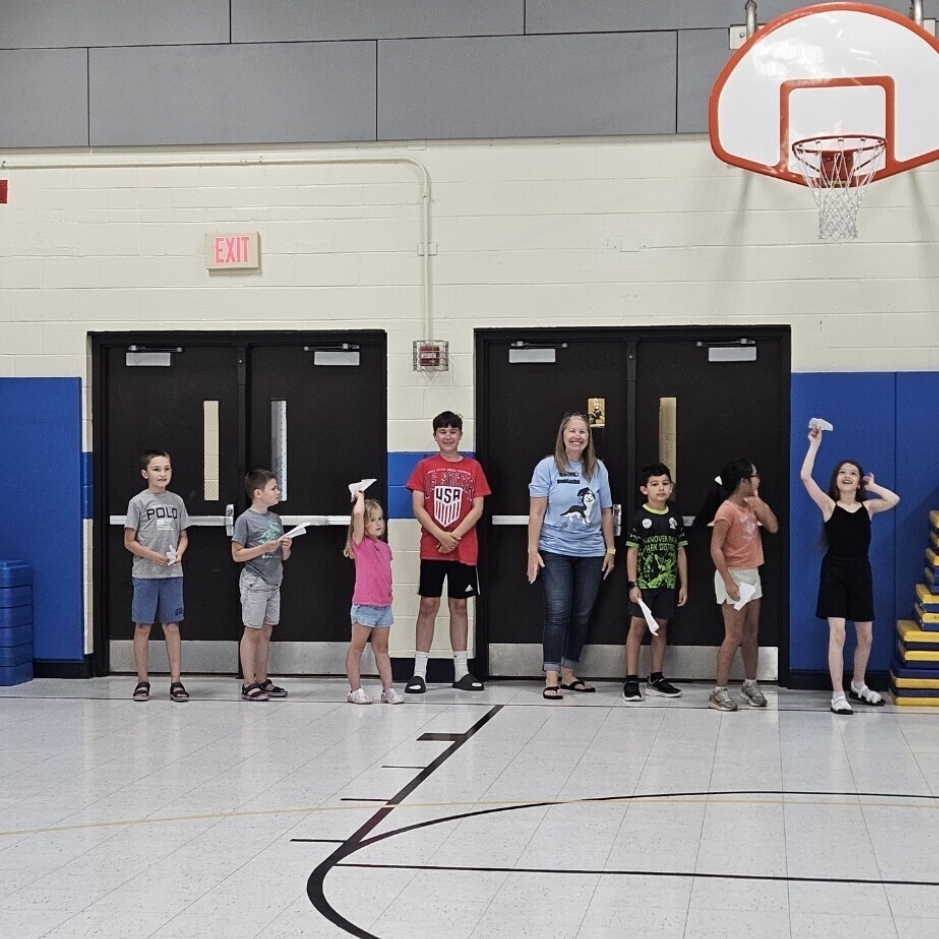 students testing their paper airplanes 