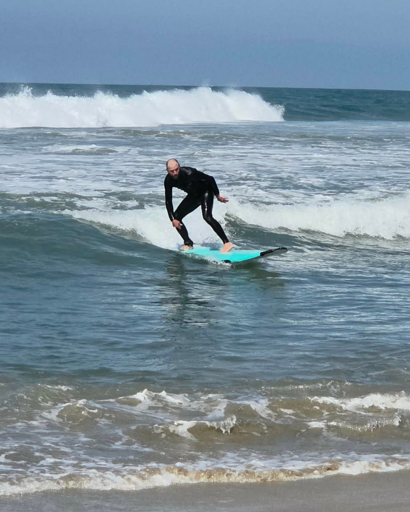Teacher surfing at Huntington Beach