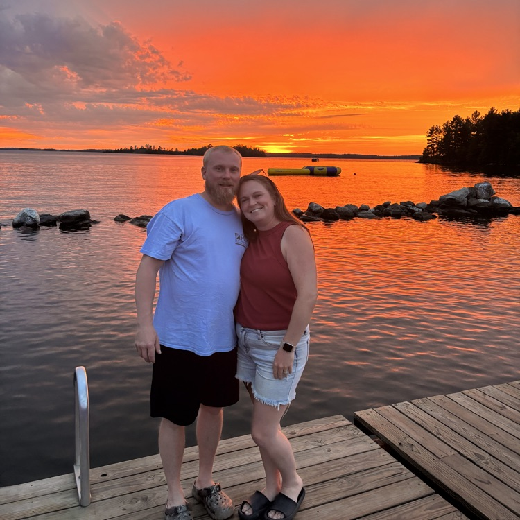 On a pier at a lake.
