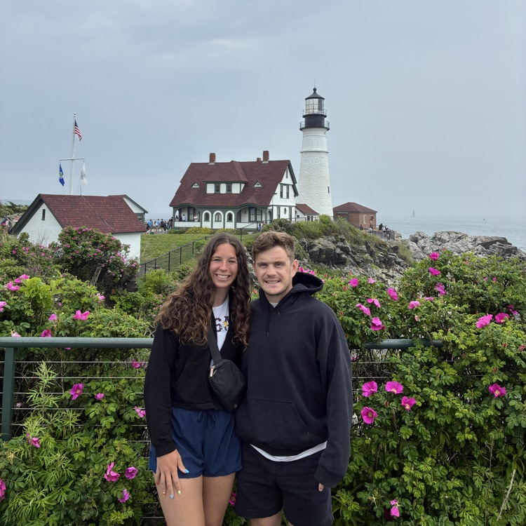 couple in front of lighthouse 