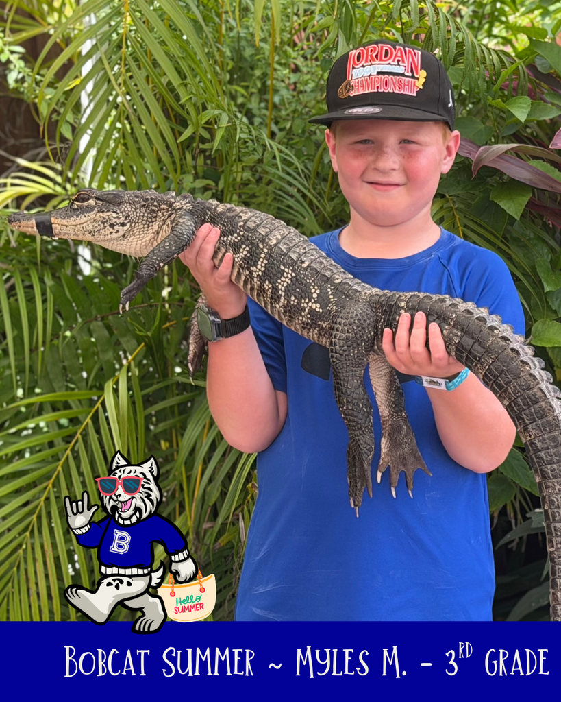 Student holding an alligator
