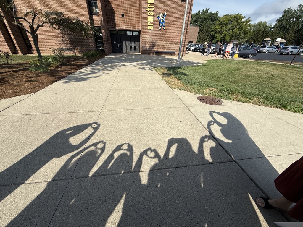 Outside of Armstrong School with shadow hearts. 