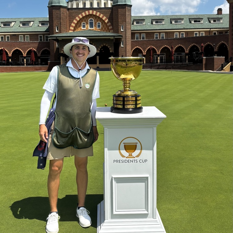 Mr. Hill with a golf trophy