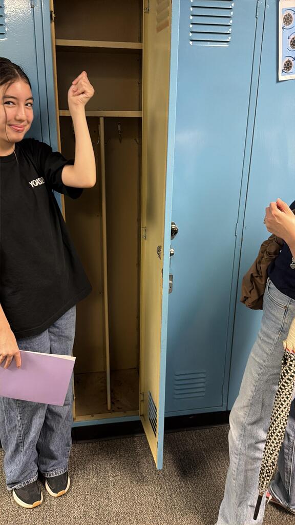 Student celebrating opening her locker