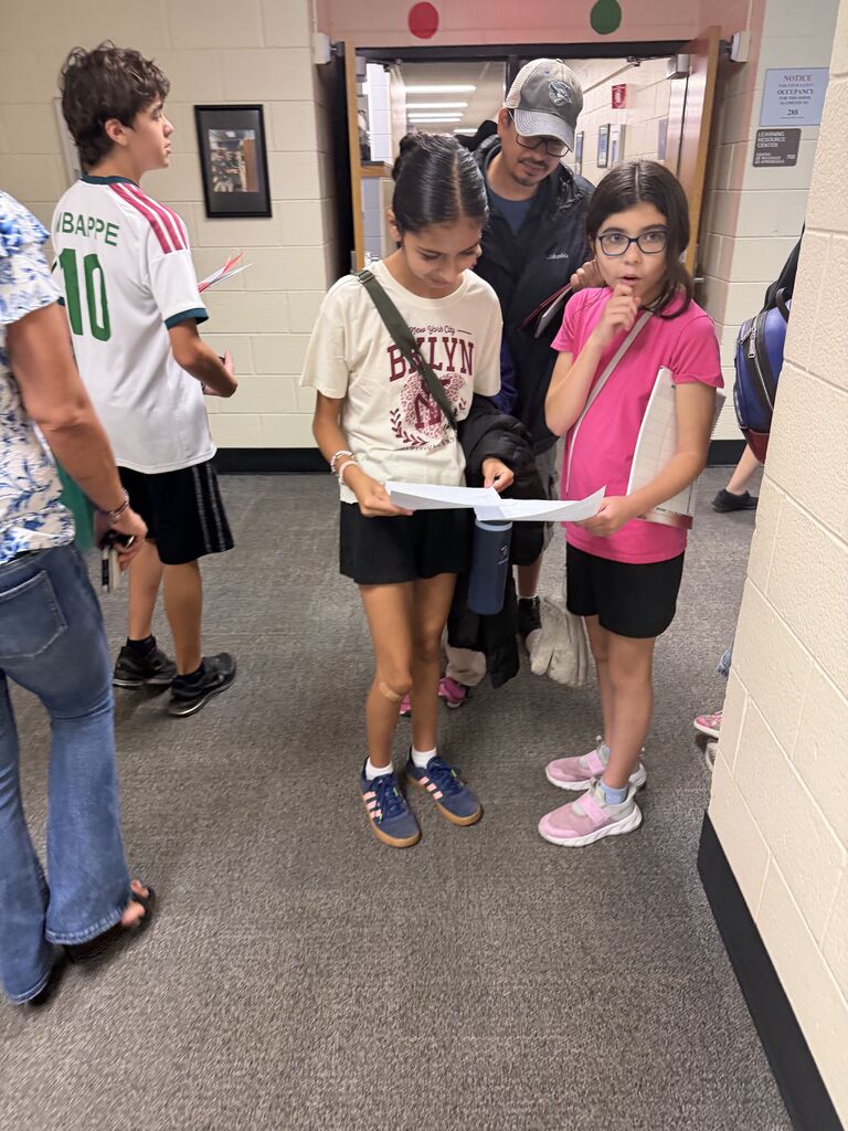 two students looking at their schedule