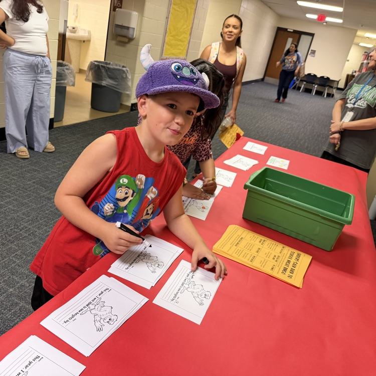 Student filling out his new school year goal.