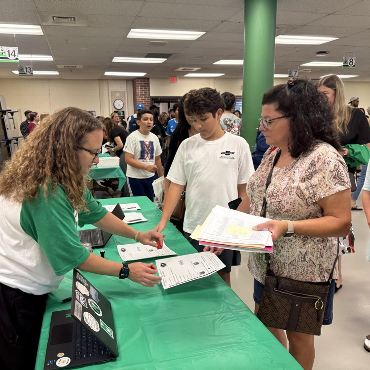 Mrs. Reimel helping parents.