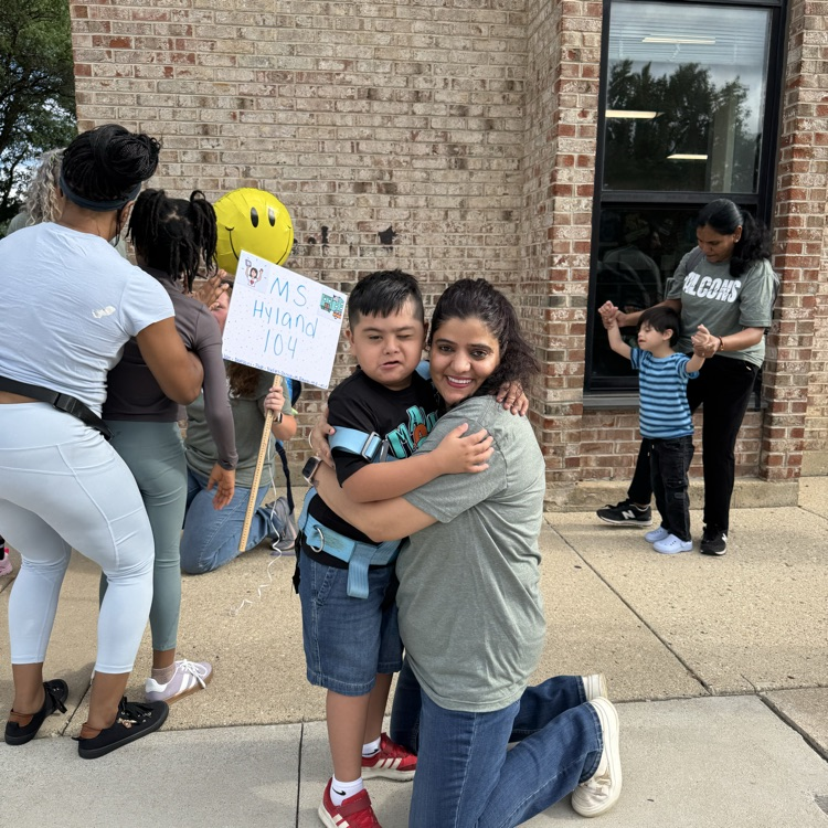 teacher greeting a student