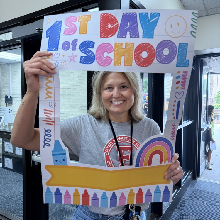 Ms. Ciesla posing in a 1st Day of School frame
