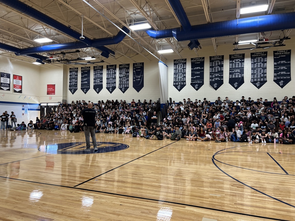 A principal talking to students on the first day of school