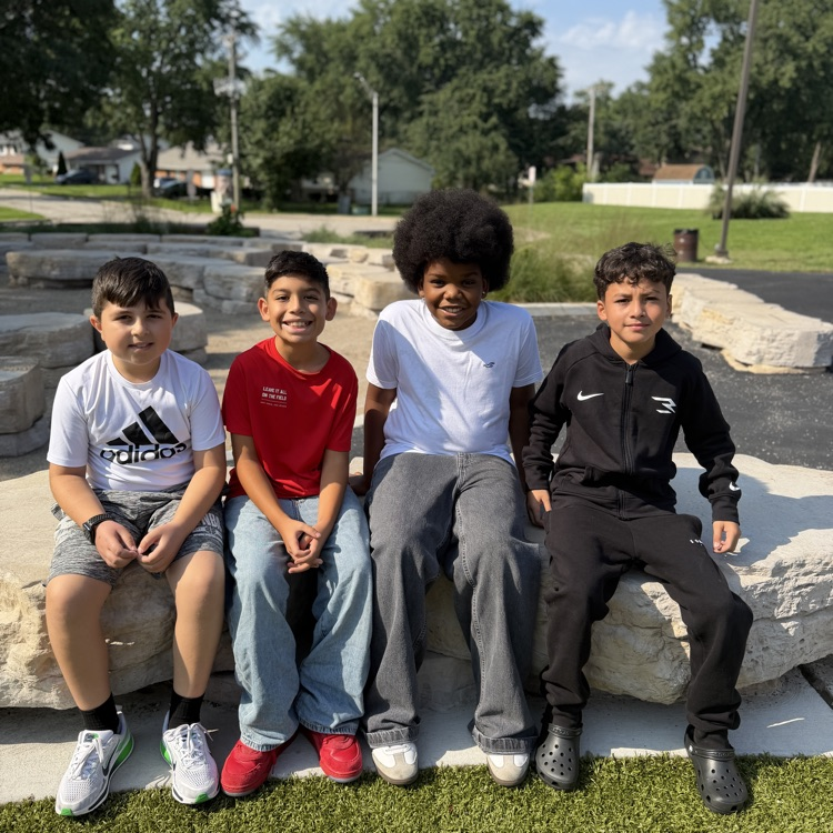 Students sitting outside on playground
