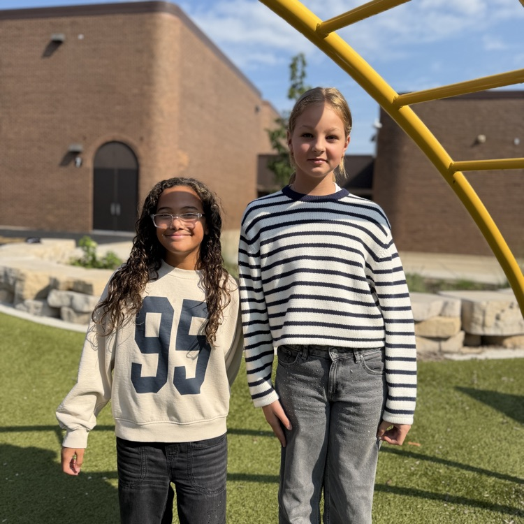 Students posing for a picture on playground 