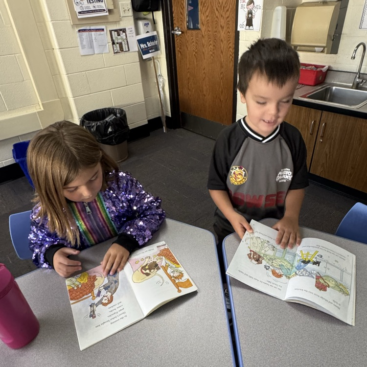 a joy and a girl reading 