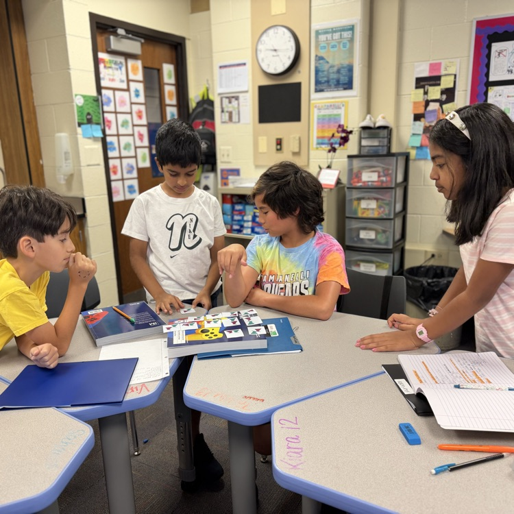 students sorting cards in math