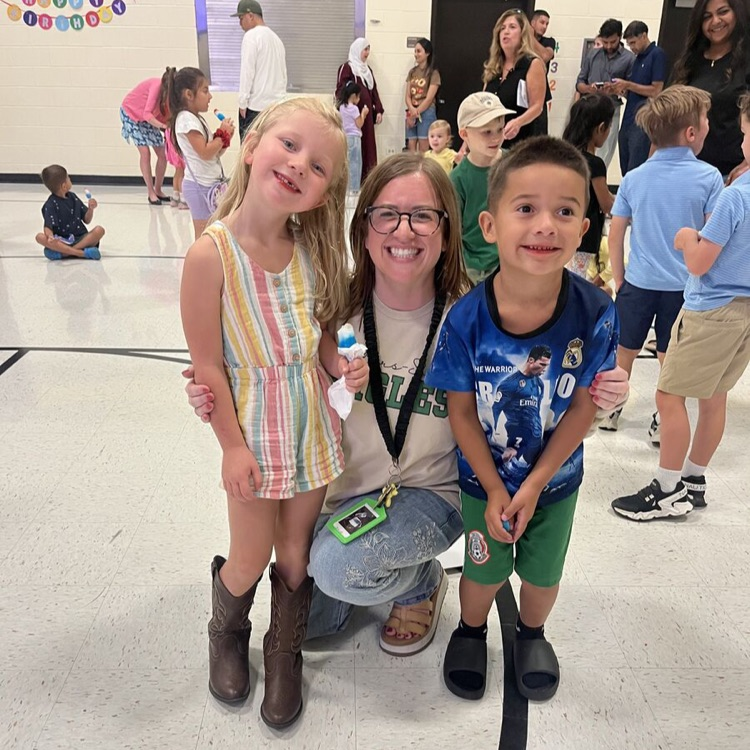 Mrs. Brown with two future kindergarteners in the gym.