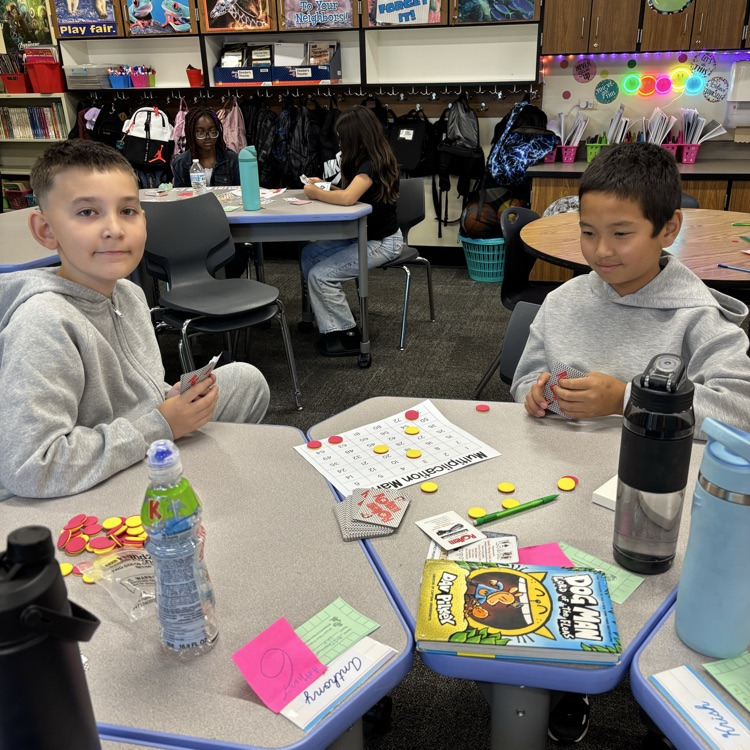 Two students playing a math game