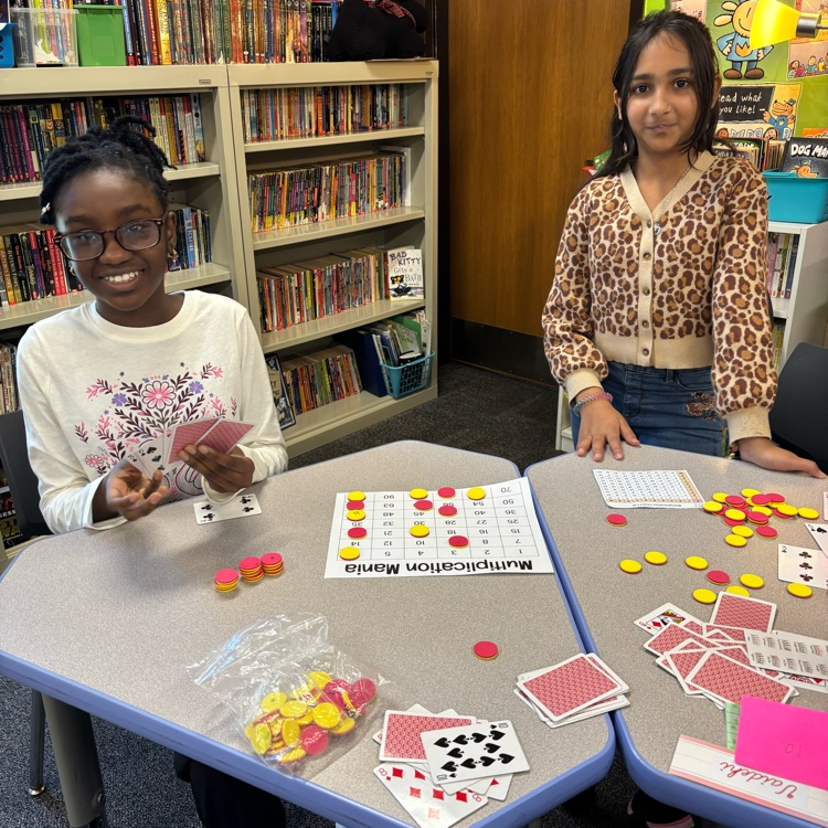 Two students playing a math game