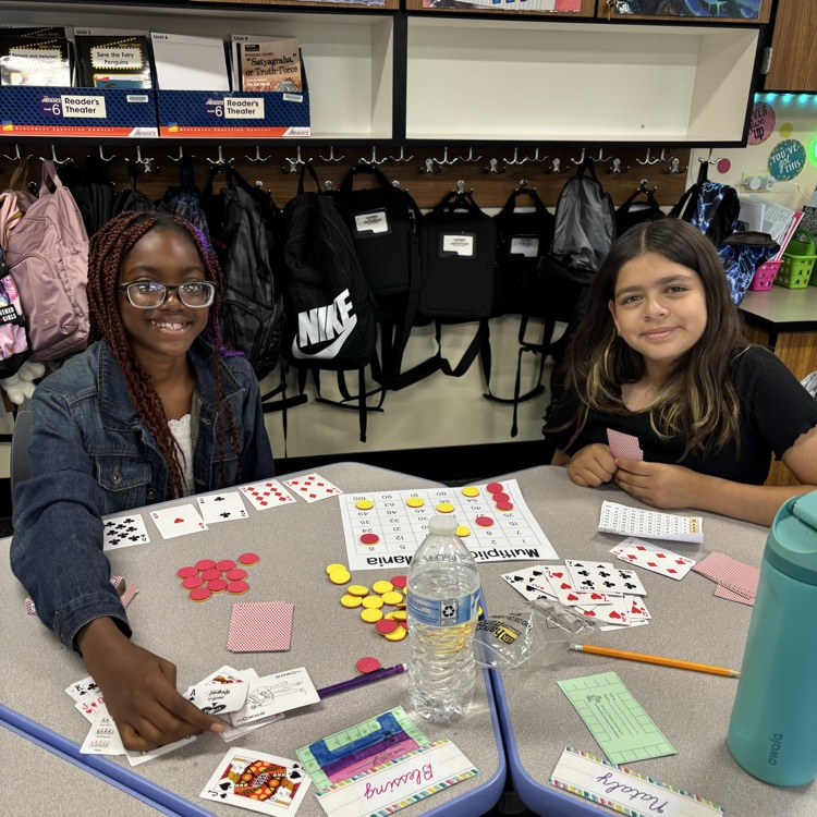 Two students playing a math game