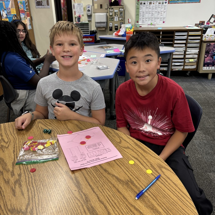 Two students playing a math game