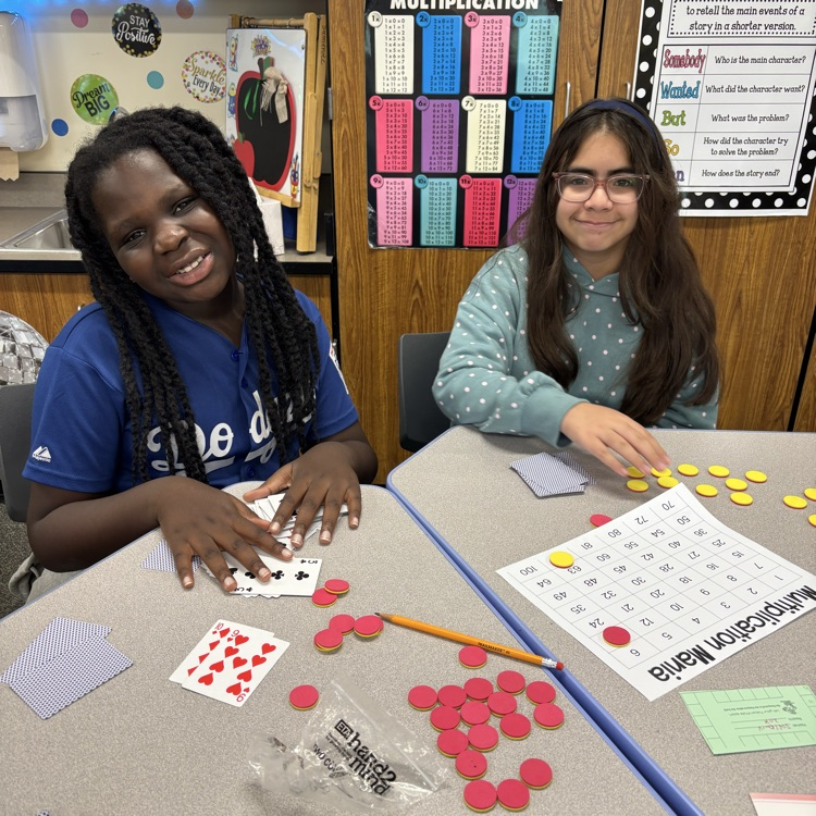 Two students playing a math game