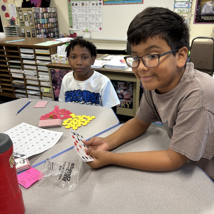 Two students playing a math game