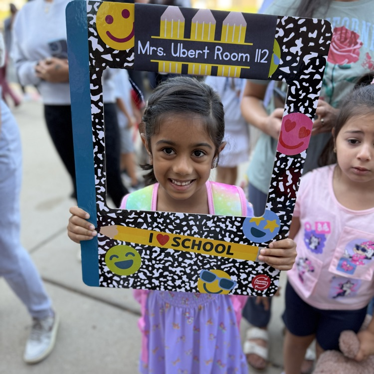 Student with a back to school sign.