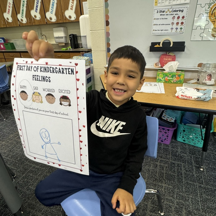 Student showing his work on how he felt the first day of school.