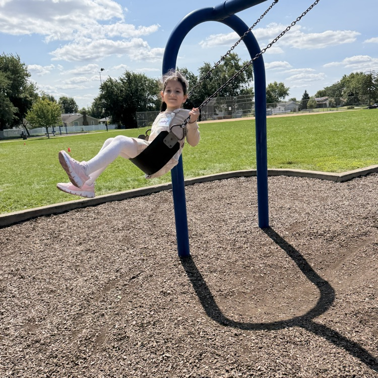 Kinder enjoying the swing.