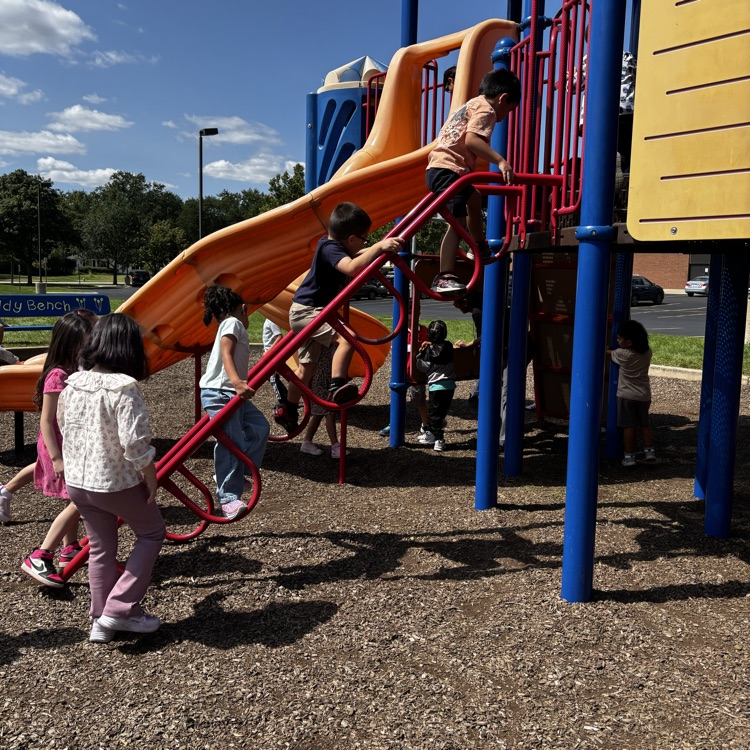 Kinders enjoying the playground.
