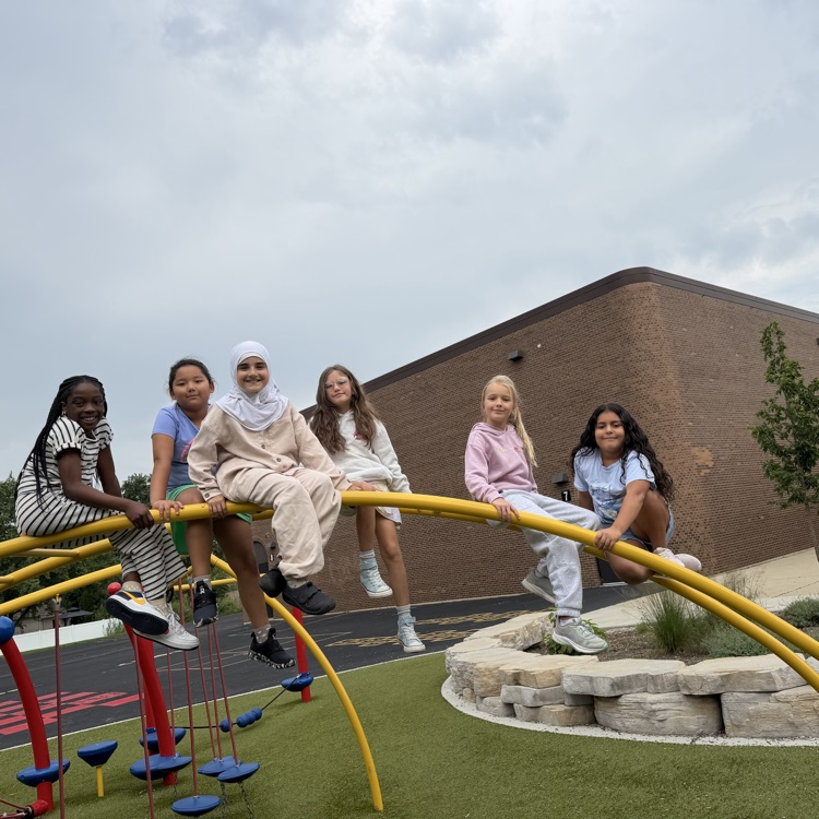 4th grade students on playground equipment