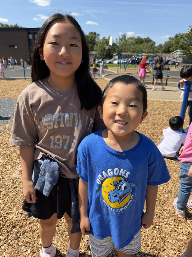 two siblings smiling