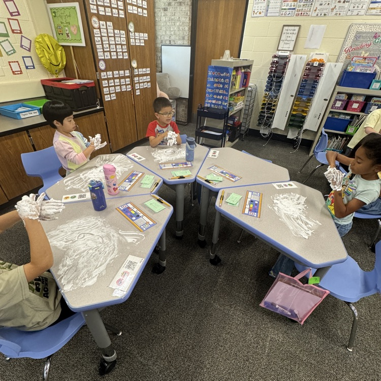 kids writing numbers in shaving cream