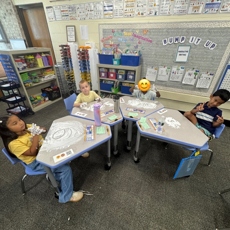 kids writing numbers in shaving cream