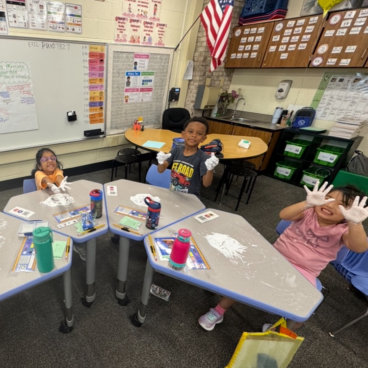 kids writing numbers in shaving cream