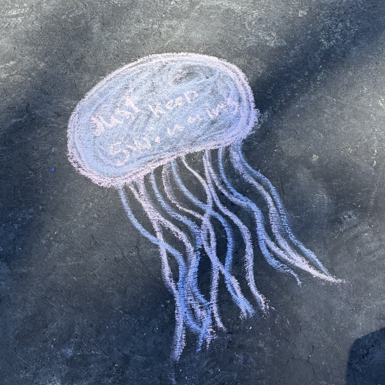 chalk art of a squid that says keep swimming