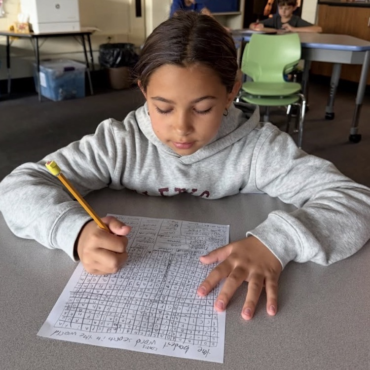 student working on word search