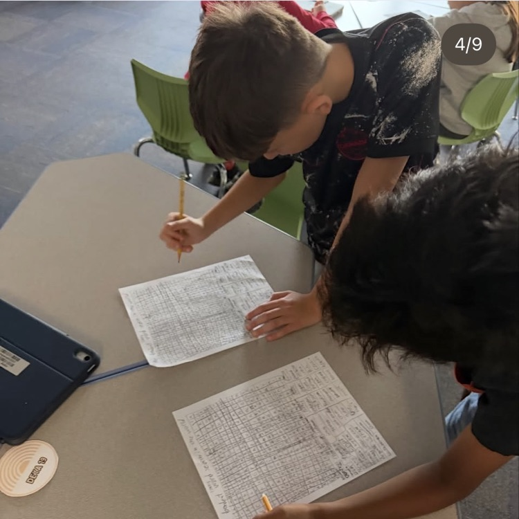 two students working on word search