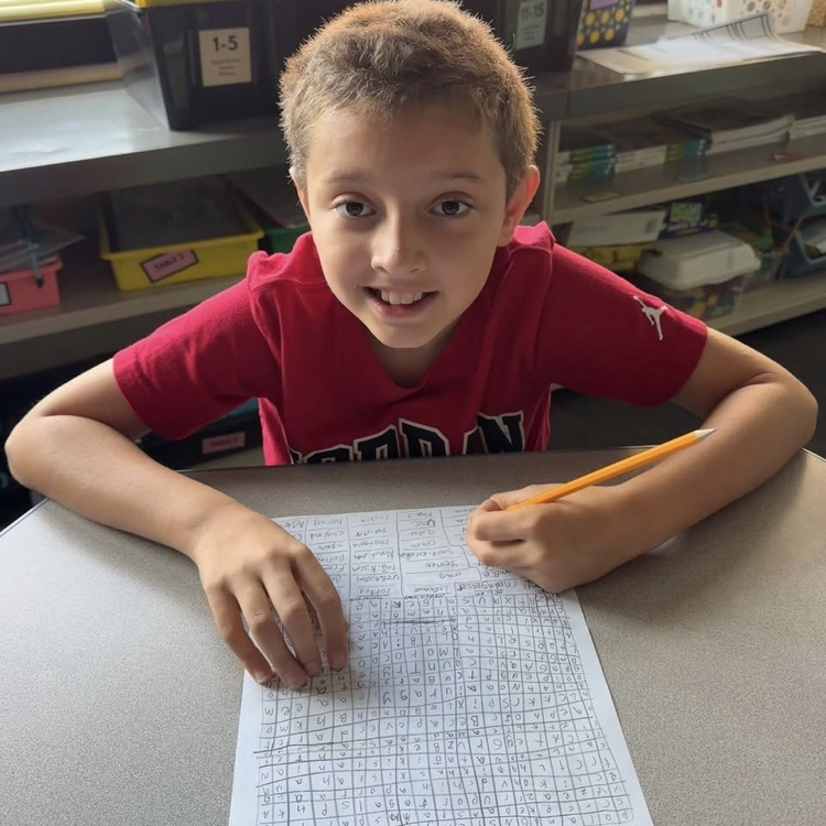 student working on word search