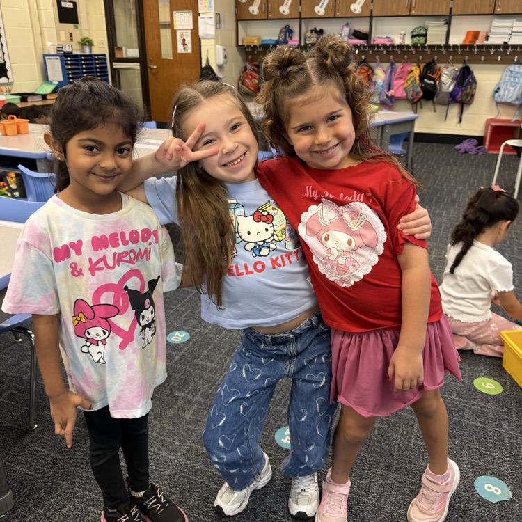 3 kindergarteners marching in Hello Kitty oufits