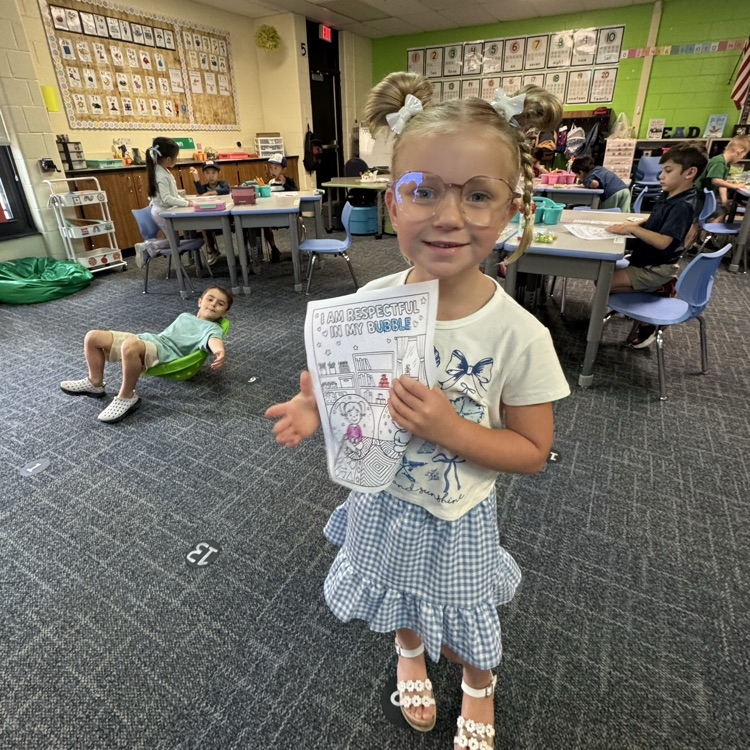 Kindergarten student and her work