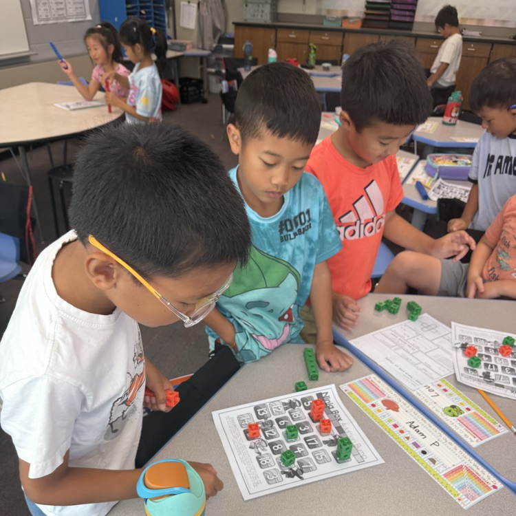 three students playing ninja addition bump