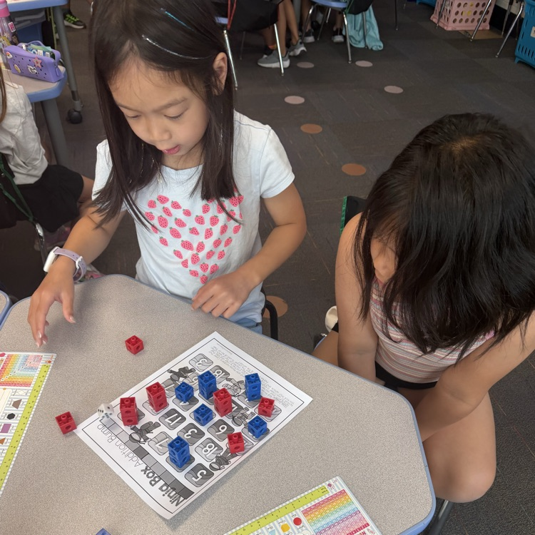 two students playing ninja addition bump