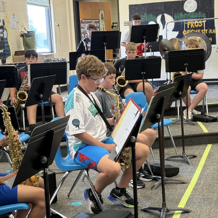 teenage students playing instruments