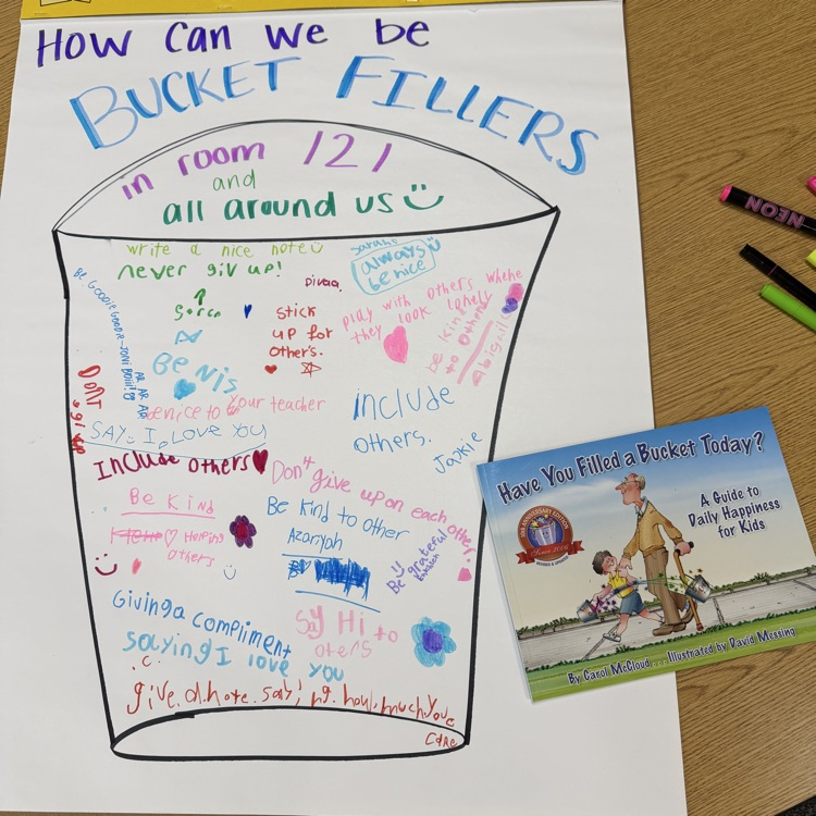 the book Have You Filled a Bucket Today? and poster with a bucket on it