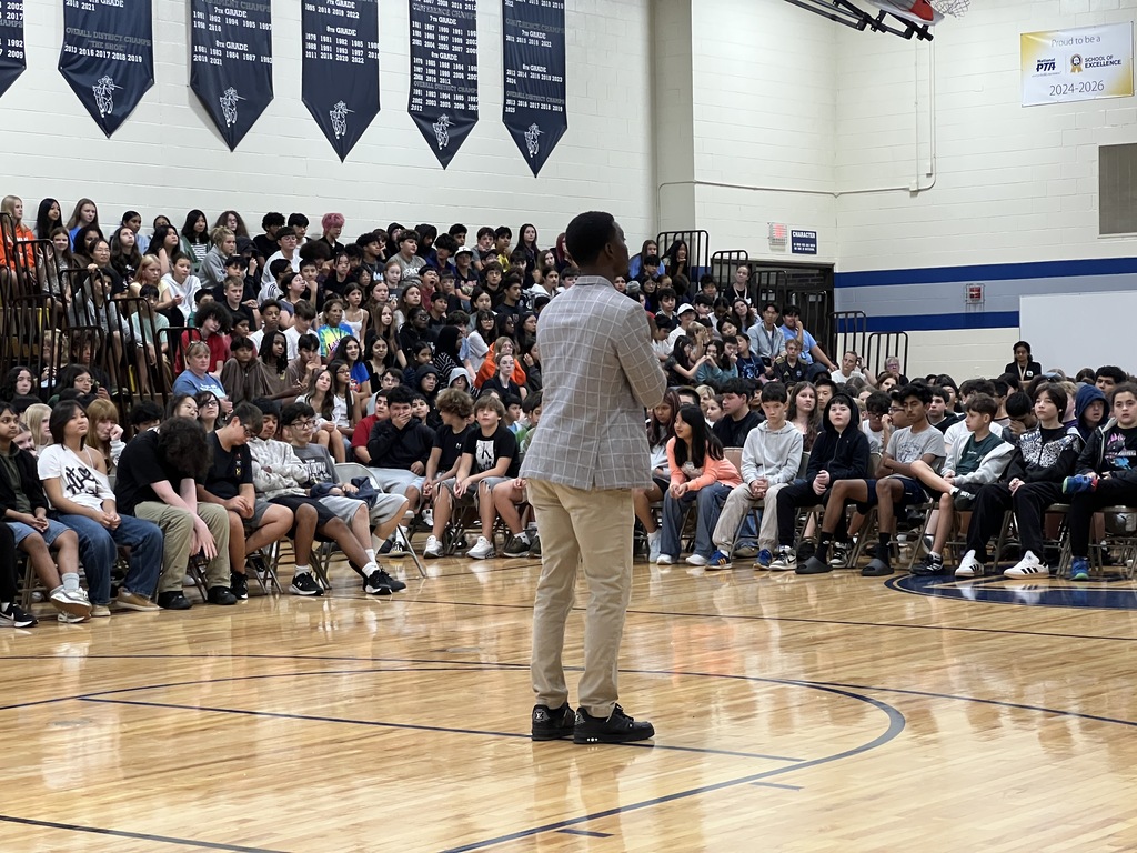 a speaker at a school assembly