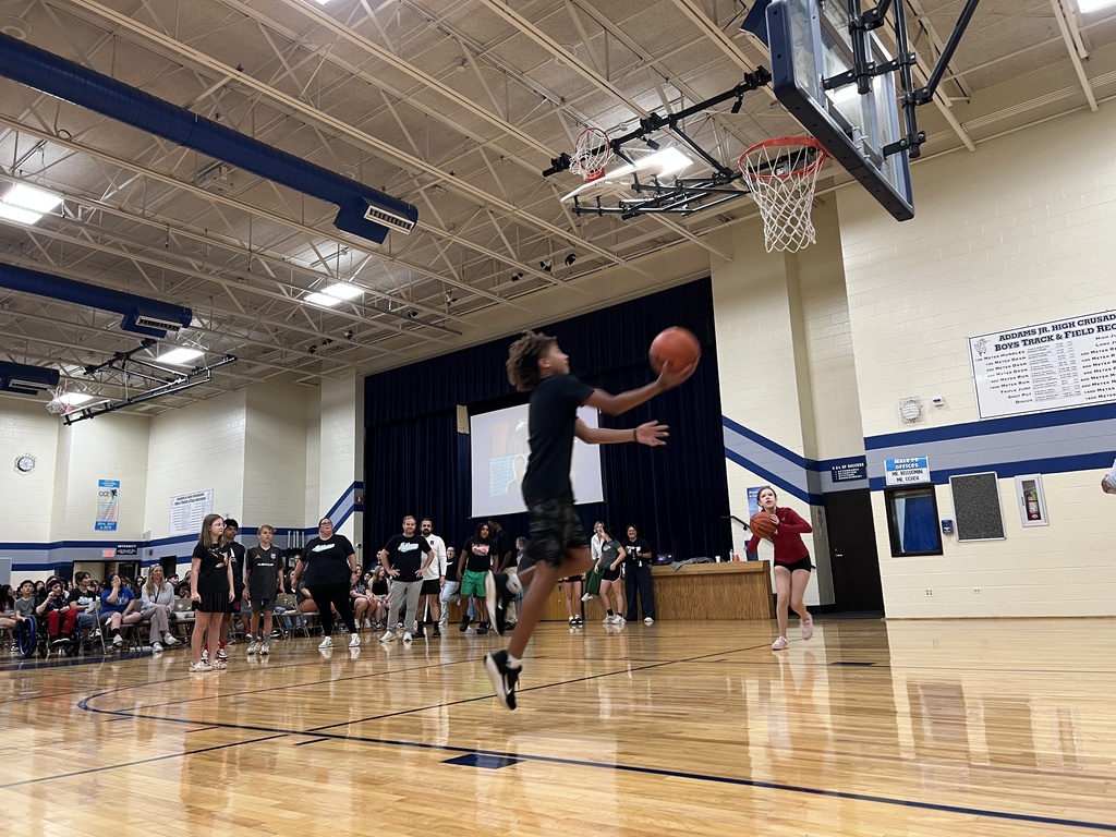 a student going for a basketball layup