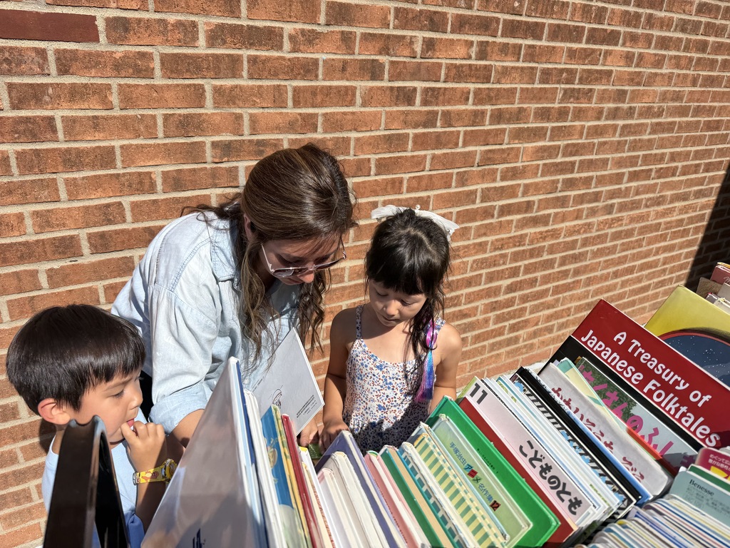Family looking at books